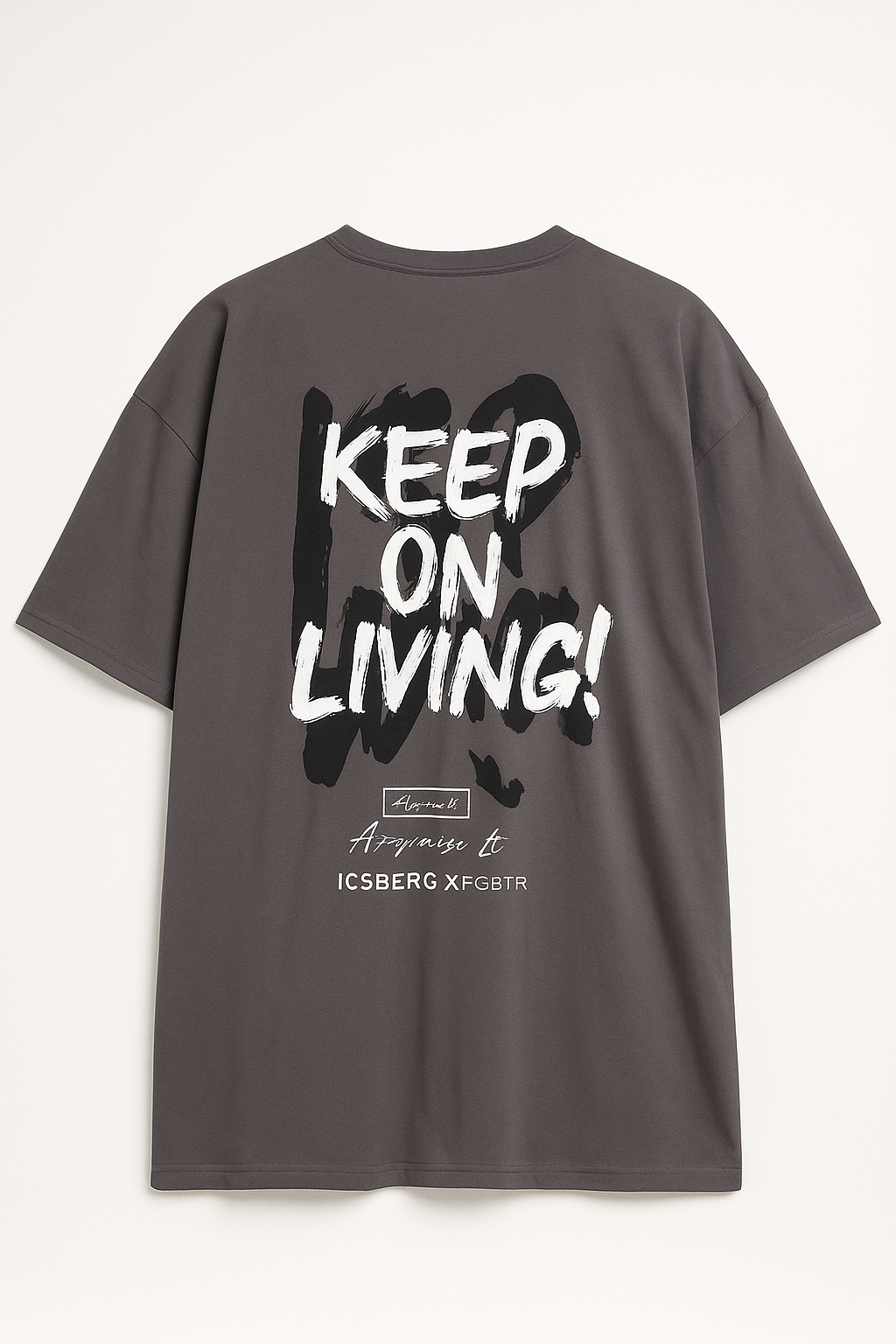 Gray motivational graphic t shirt with Keep On Living text and black paint brush design on back